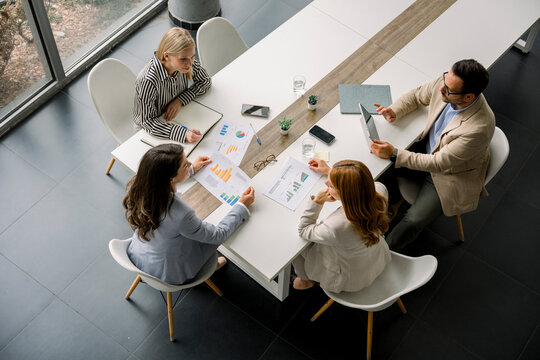 Business team discussing project at modern office table