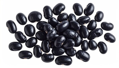 Shiny black beans scattered on white, close-up, high-angle view