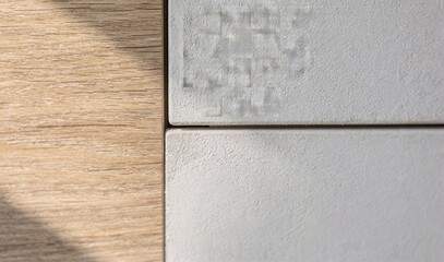 Minimalist material composition with wood and textured plaster tiles in modern interior, Generative AI
