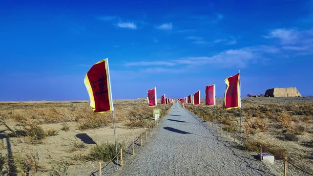 Red Flags At Yumen Pass, Historic Site And Key Military Outpost On The Ancient Silk Road in Dunhuang, Gansu Province, China. POV Shot