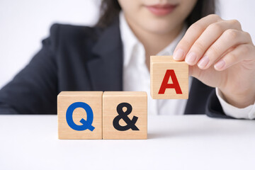 Q&A Concept with Wooden Blocks and Business Person