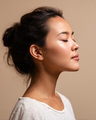 Relaxed East Asian Woman in Profile with Eyes Closed, Peaceful Moment
