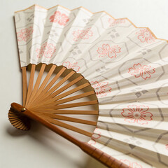 Decorative paper fan with floral design in detailed craftsmanship  