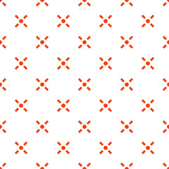 A seamless pattern of small orange crosses on a white background