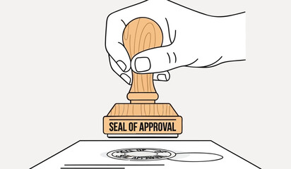 Hand applying seal of approval stamp on document with rubber stamp