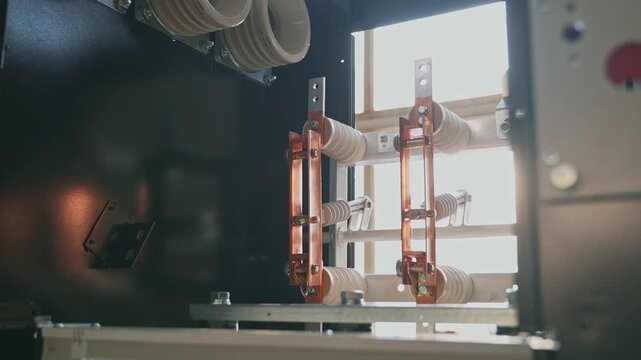 Electrical insulators and copper busbars inside high voltage switchgear