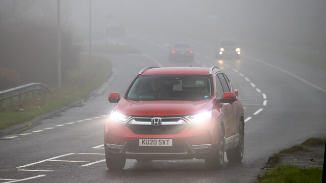 Milton Keynes,Bucks,UK - Jan 18th 2026: 2020 red Honda CR-V hybrid electric SUV car driving on a British road on a damp,foggy morning.