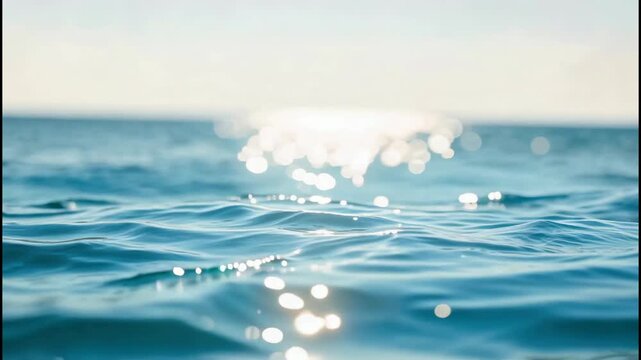 The video showcases close up views of the ocean's surface, highlighting the shimmering and reflective qualities of the water under sunlight