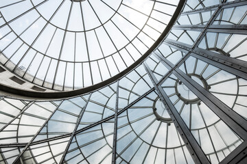 Circular dome skylight glass geometry structure with modern architecture pattern and reflection in daylight creating elegant abstract background