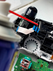Fototapeta premium Cleaning and repairing game controller joystick, gaming maintenance and electronics repair concept