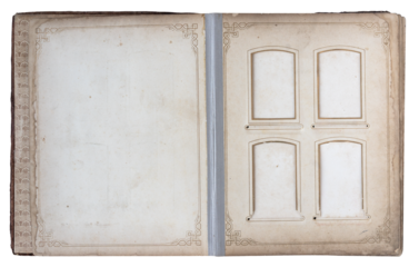 Open vintage old photo album with decorative square frames and blank pages showing aged paper texture