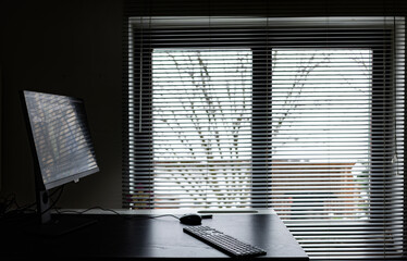 desk with keyboard and monitor