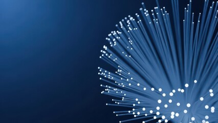 Glowing fiber optic strands converge on dark blue background, radiating light
