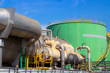 Naklejka premium Demineralized water tank and multi effect desalination plant (MED) at industrial power plant. A thermal technology uses steam to produce distilate water from seawater