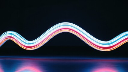 Wavy neon light trail on reflective dark surface