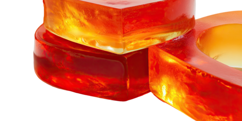 Close-up of layered, transparent, heart-shaped objects in orange and red hues