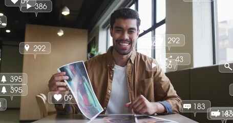 Animation of social media icons and numbers over businessman - Powered by Adobe