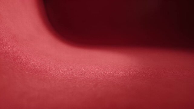 Abstract red surface with soft lighting and smooth textures