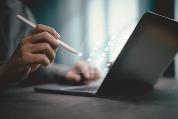 Person Using Digital Pen to Organize Files on Laptop with Virtual Folder Structure