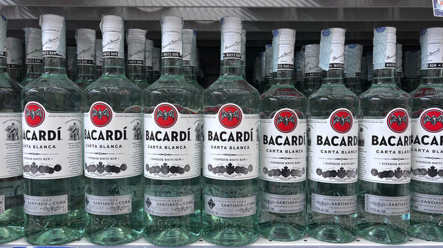 bottles of Bacardi rum arranged on the store shelf. Udine, Italy. October 12, 2025