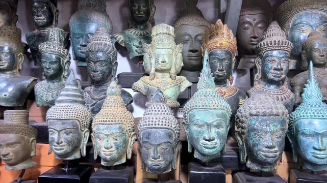 CAMBODIA - October 2, 2025: Many different souvenirs at the street market in Siem Reap. Amulets at the old souvenir market "Psah Chas, Psar Chas, Psar Chaa". Buddha statues. Handicrafts. 4К