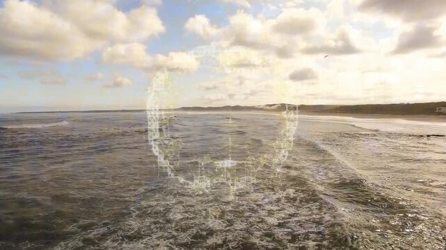 Ocean waves meeting sandy shore with digital network animation overlay