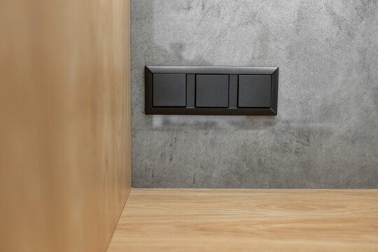 Modern electrical anthracite power socket and plug switched waterproof with cover.