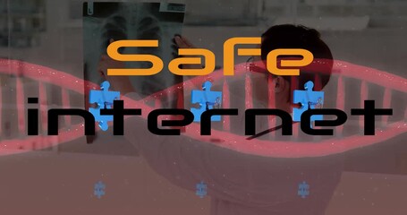 Animation of safe internet text and puzzle over caucasian scientist with xray - Powered by Adobe