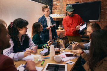 Confident team collaborating in modern office workspace. Concept of productive workflow, professional communication, business teamwork for corporate and startup use.
