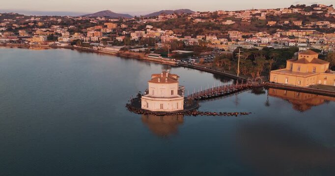 Aerial view of Casina Vanvitelliana in Fusaro Lake, a unique architectural gem reflecting on the calm water, Fusaro Lake, Campania, Italy.