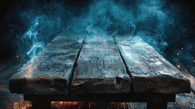Blank wooden table with fire and smoke concept. Mystical wooden table with smoke and sparks creates an intriguing atmosphere.