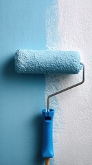 Obraz premium Paint roller with blue paint, renovation and home improvement concept