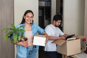 Young couple moving to new home celebrating achievements
