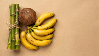 Celebration of Ugadi with fruits, sugarcane, and cultural items on a flat surface in India