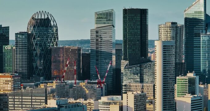 Business district buildings Paris, France. Aerial view of the office windows of a glass skyscrapers. Corporate company head quarter in urban environment. Architectural trends