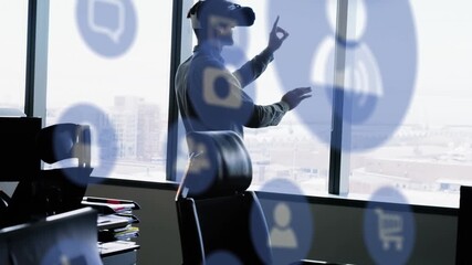 Animation of digital icons over caucasian businessman wearing vr headset - Powered by Adobe