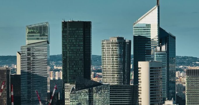 Business district buildings Paris, France. Aerial view of the office windows of a glass skyscrapers. Corporate company head quarter in urban environment. Architectural trends