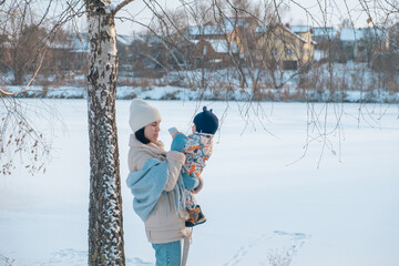 Portrait of Mother and Baby in Winter Wonderland