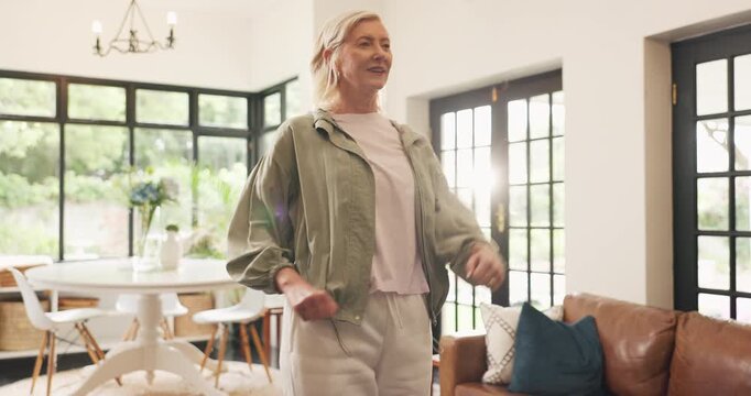 Senior woman, exercise and marching in home for cardio, warm up or low impact aerobic conditioning. Fitness, smile and elderly person training in living room for wellness, body health and retirement