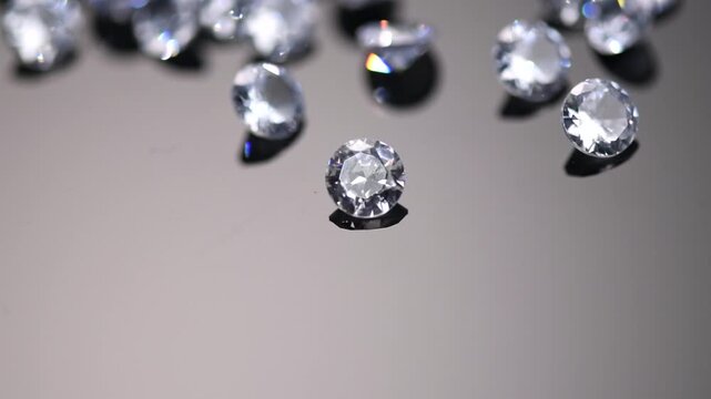 Diamonds gems crystals sparkling on black background, beautiful shining brilliants blinking with colorful caustics, rainbow lights. Moissanite. Zirconia. Diamonds sparkle and shimmer on black. Closeup