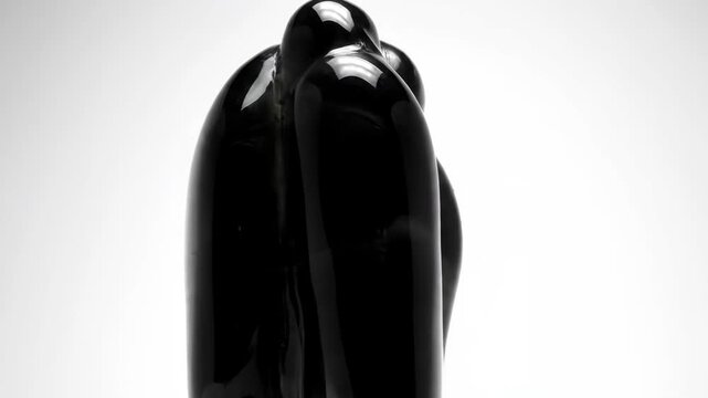 Abstract black sculpture on white background