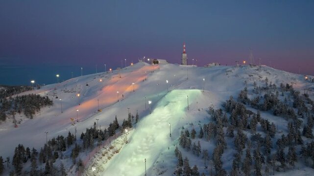 4K cinematic drone footage of Ruka Ski Resort , Finland during golden hour at the winter solstice_05