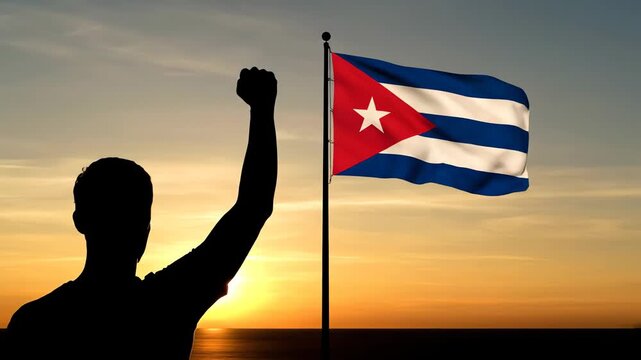 Cuban man celebrating independence with raised fist at sunset