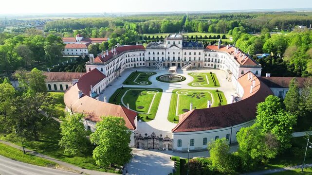 Aerial view of the Esterhazy Palace standing majestically amidst lush greenery, showcasing architectural grandeur and manicured gardens, Fertod, Ferto-Hansag, Hungary.