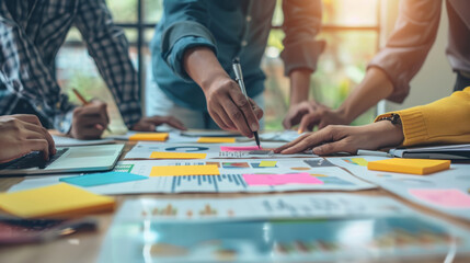 Confident creative professional leading a brainstorming session in a modern startup office.