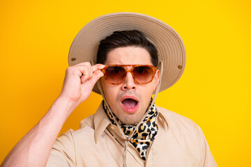 Surprised man in safari hat sunglass and leopard scarf ready for adventure travel and summer exploration © deagreez