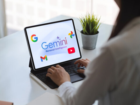 Woman using google gemini personal intelligence on tablet