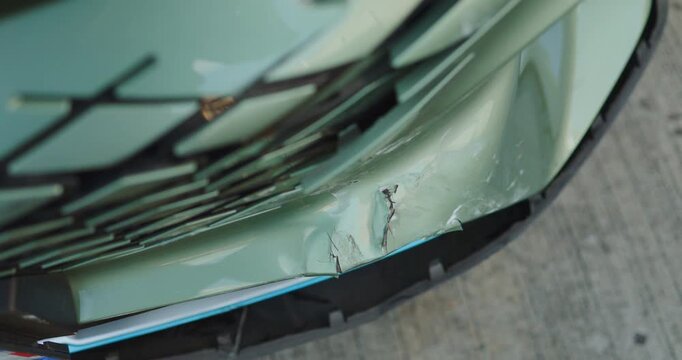 Close-up of car damage after a traffic collision, illustrating the auto insurance claim process, vehicle insurance coverage, accident repair, and motor insurance protection concept	
