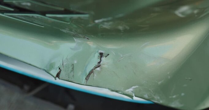 Close-up of car damage after a traffic collision, illustrating the auto insurance claim process, vehicle insurance coverage, accident repair, and motor insurance protection concept	

