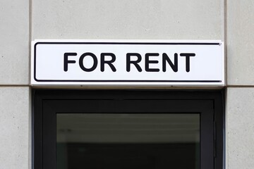 Obraz premium For Rent Signage or Sign Word or Text on Top of Silver or Metallic Door for Room Concept.